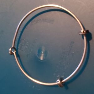 Charm bracelet has stoppers